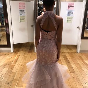 Elegant mermaid pink dress with open back.